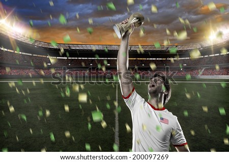 American soccer player, celebrating the championship with a trophy in his hand. On a stadium.