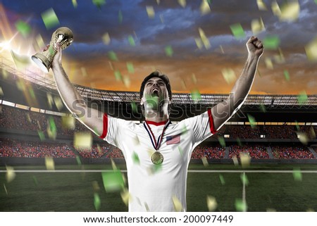 American soccer player, celebrating the championship with a trophy in his hand. On a stadium.