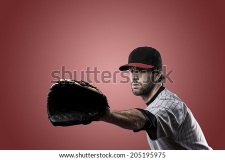 Baseball Player on a Red Uniform on red background.