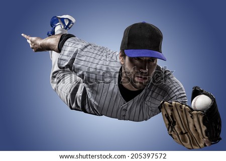 Baseball Player on a Blue Uniform on blue background.