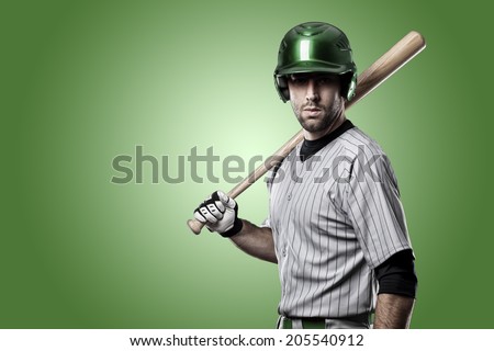 Baseball Player on a Green Uniform on Green background.