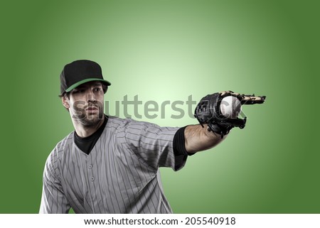 Baseball Player on a Green Uniform on Green background.