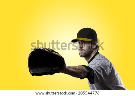 Baseball Player on a yellow Uniform on yellow background.