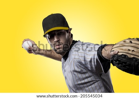 Baseball Player on a yellow Uniform on yellow background.