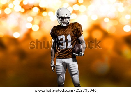 Football Player on a Orange uniform, on a orange lights background.