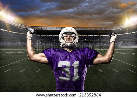 Football Player on a purple uniform celebrating on a stadium background.
