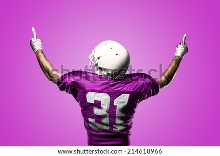 Football Player on a pink uniform celebrating on a pink background.