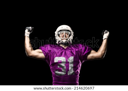 Football Player on a pink uniform celebrating on a black background.