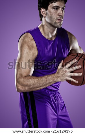 Basketball player on a  purple uniform, on a purple background.
