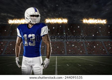 Football Player with a blue uniform on a stadium.