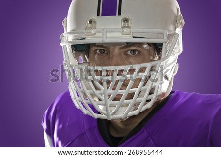 Close up in the eyes of a Football Player with a purple uniform on a purple background.