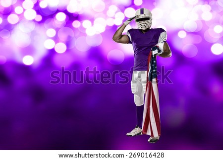 Football Player with a purple uniform saluting with a american flag, on a purple lights background.