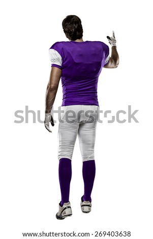 Football Player with a purple uniform walking, showing his back on a white background.