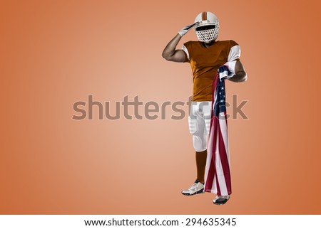 Football Player with a orange uniform saluting with a american flag, on a orange background.