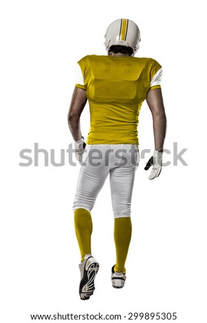 Football Player with a yellow uniform walking, showing his back on a white background.