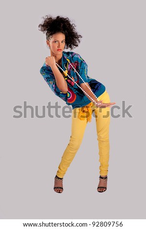 stock photo High Fashion Model Poses Black Hair blue dress yellow pants