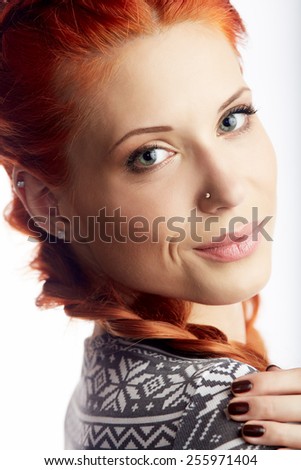 Portrait of beautiful woman in knitted dress. Fashion photo. Redhead girl