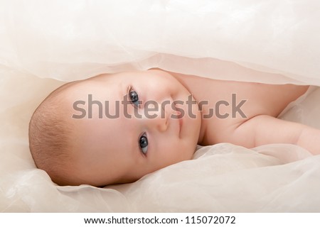 beautiful baby boy\'s face with soft cover