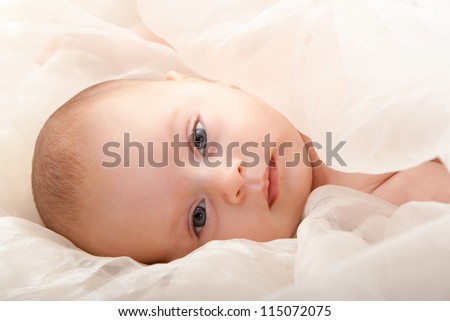 beautiful baby boy\'s face with soft cover