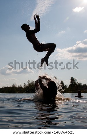 young man jumping in the water