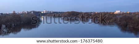 Trees reflection on water, flooded during the spring flood. Panoramic landscape.