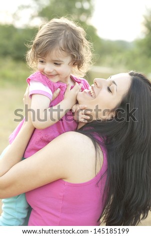 Mother and child enjoying hot summer outdoors