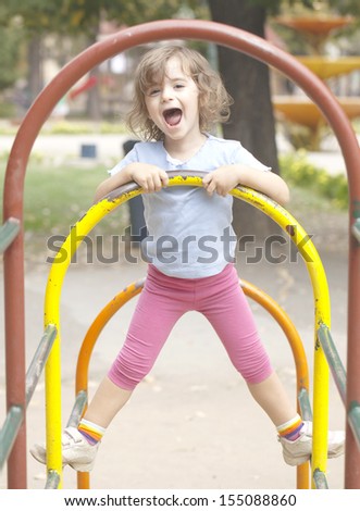 Little girl enjoying in the fun park
