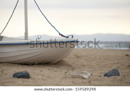 The aft of an old left out boat at the beach