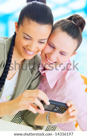 Two young businesswomen taking picture