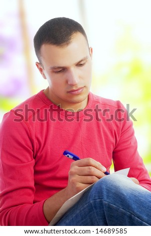 young man writing letter