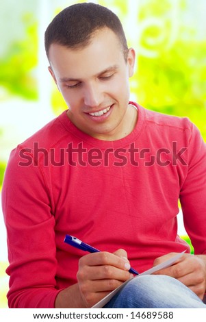 young man writing letter