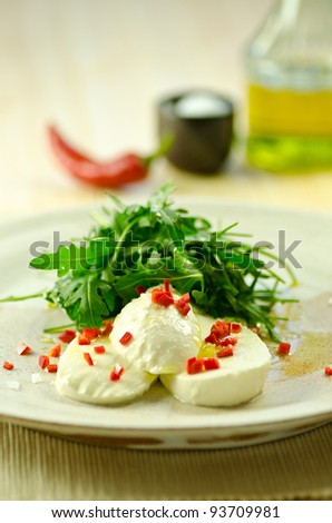 mozzarella with chilli oil and rocket leaves