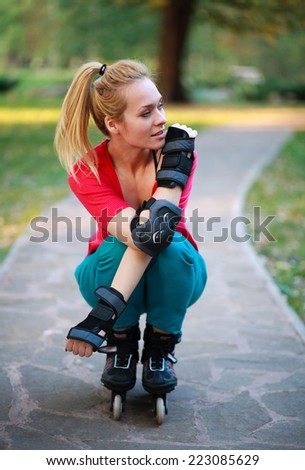 Roller sporty girl in park, woman outdoor fitness activities