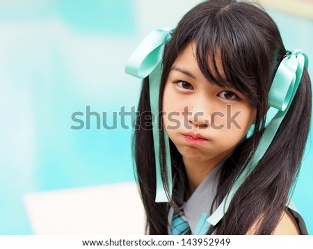 Pretty cosplay girl showing angry face