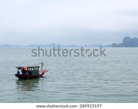 HA LONG BAY, VIETNAM - MAY 24: A local boat at Ha Long Bay, Vietnam on May 24, 2015. Ha Long Bay is a UNESCO World Heritage Site, and a popular travel destination, in Vietnam.