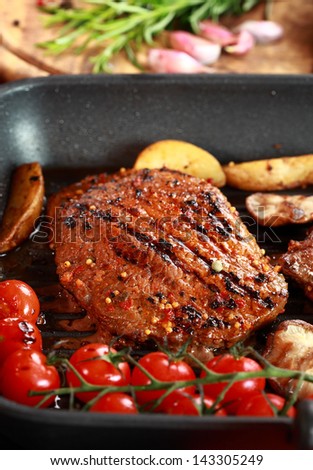 Delicious steak with grilled vegetable and mushrooms