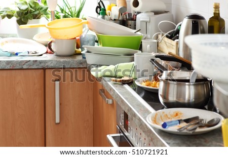 Pile of dirty dishes in the kitchen - Compulsive Hoarding Syndrom