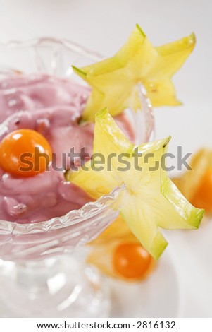 Cup of fruit yogurt with exotic fruits