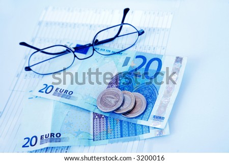 Money on the billing sheet in blue tone