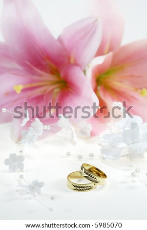 stock photo Beautiful golden wedding rings with flowers