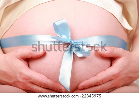 Mother to be - detail of belly and ribbon