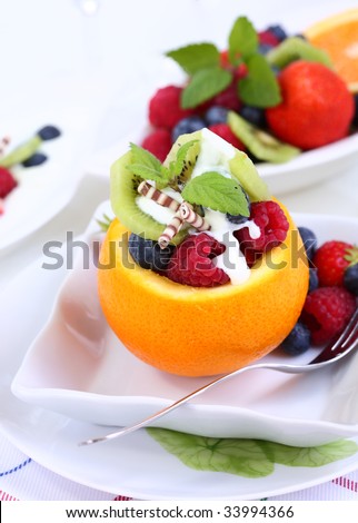 Low calorie dessert - orange filled with fruits