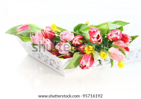 Home appliance - beautiful spring flowers on the table