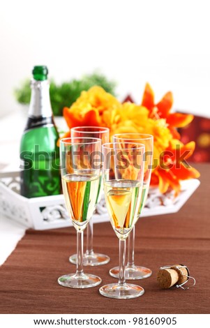 Sparkling wine with bouquet and wine bottle