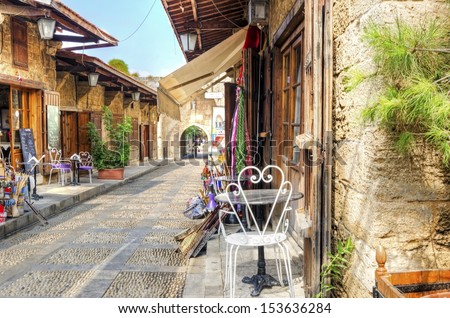 The Old Medieval Pedestrian Souk In Byblos, Lebanon During The Day. A View Of The Little Shops And Streets Paved With Little Stones.