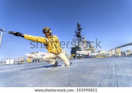 SAN DIEGO,USA - FEBRUARY 24 2014: A statue of a Flight Deck Director, catapult officer, signaling aircrafts into position on the deck, on the USS Midway Museum in San Diego,California, USA