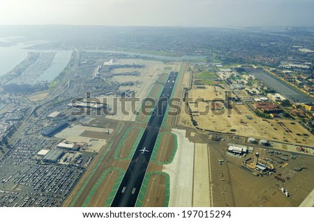 Aerial view of the San Diego International Airport, river and pacific ocean, in Southern California. Lindbergh Field is the busiest single runway commercial airport in the United States of America.