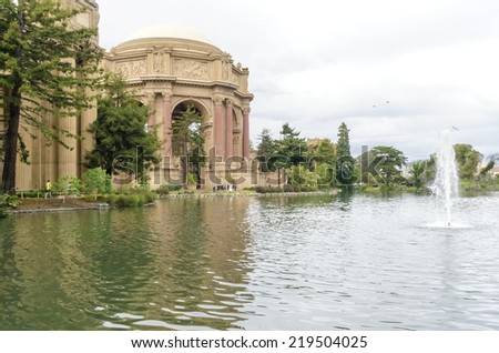 SAN FRANCISCO,USA - MARCH 1 2014:A view of the dome rotunda of the Palace of Fine Arts in California,United States. A colonnade roman greek architecture with statues and sculptures around a lagoon.