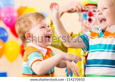 joyful kids with clown on birthday party joyful kids with clown on birthday party