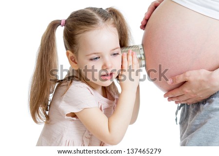Kid girl listening with can pregnant mother's stomach Kid girl listening with can pregnant mother's stomach